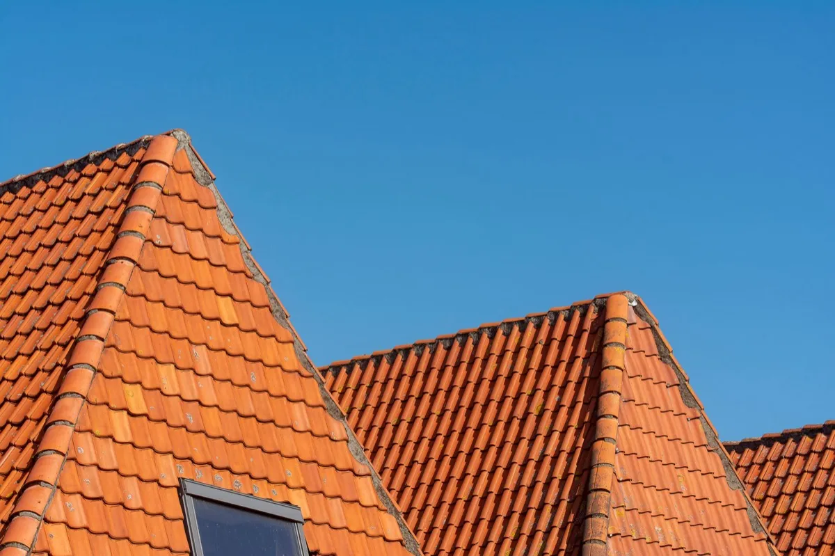 Clay barrel tile rooflines on homes in Rogers, AR