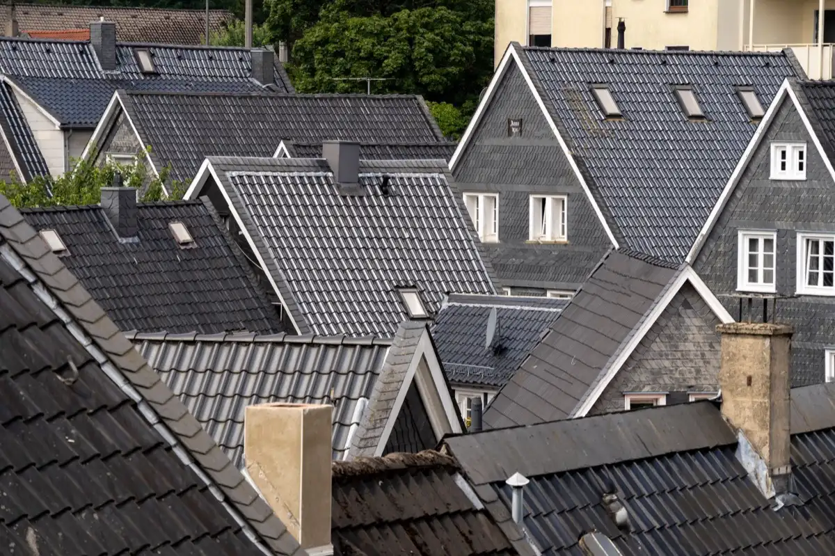 Steep roof eaves and gutter lines on houses in Rogers, AR